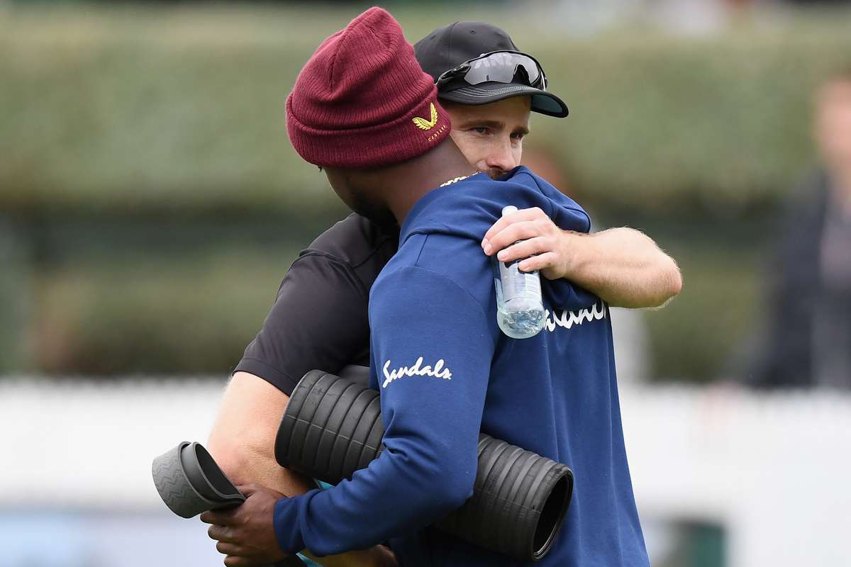 Kane Williamson embraces Kemar Roach as a gesture of grief for the loss of his father