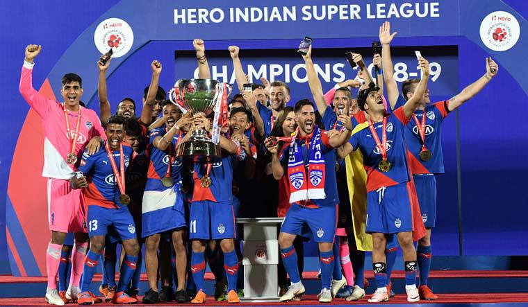 Bengaluru FC players lifting the 2018-19 ISL trophy