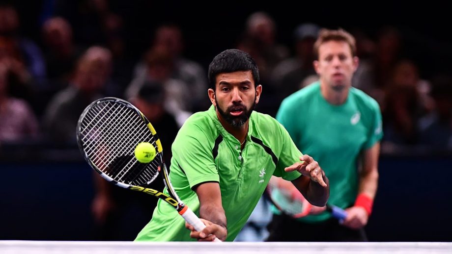 Rohan Bopanna takes a shot at the net during the match
