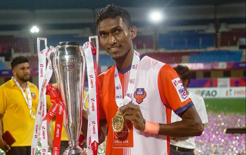 Lenny Rodrigies with the Super Cup Trophy