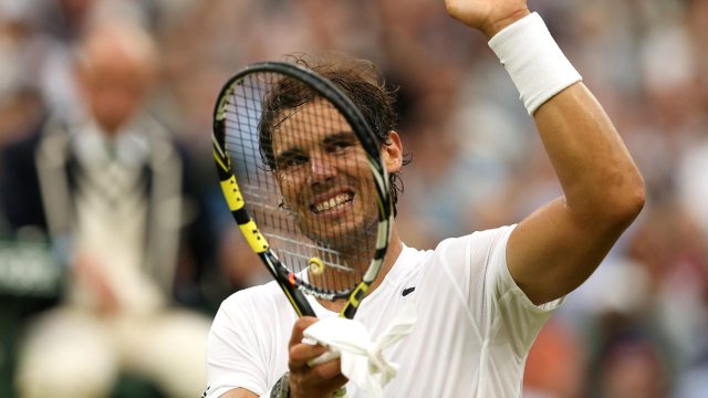 Rafael Nadal laughs during the match